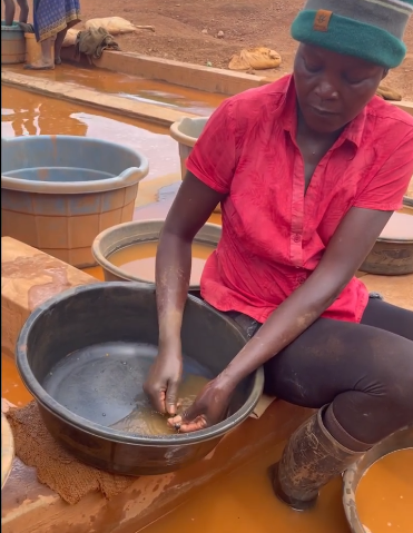 woman washing gold in kenya